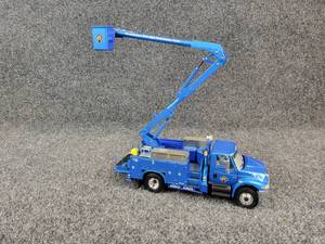 lot 70 image: First Gear 2002 International Utility Boom Truck 134 Scale Diecast Model