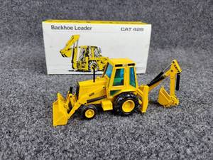 lot 99 image: NZG Caterpillar 428 Backhoe Loader 150 Scale Diecast Model - Made in West Germany