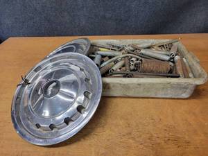 Large Container of Assorted Springs and (2) hubcaps