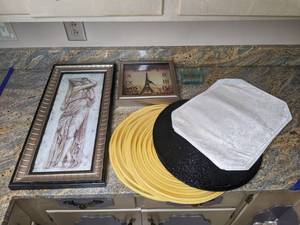 lot 271 image: Kitchen Decor Summer Goddess by Tina Chaden Framed Wall Art, (3) Sets of Placemats, (4) Glass Coasters, and a Square Wall Clock