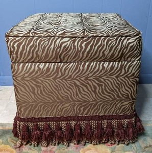 lot 81 image: Zebra Striped Storage Ottoman with Coordinating Tassel Trim