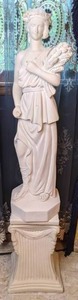 lot 122 image: Greek Inspired Statue of Woman Carrying Sheaf of Wheat on Pedestal
