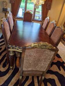 lot 2 image: Elegant Dining room Set Table, (8) Chairs & Tiger Print Rug