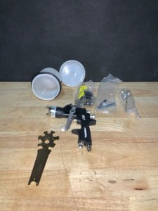 lot 26 image: Husky Gravity Feed Composite HVLP Spray Gun. See Pictures