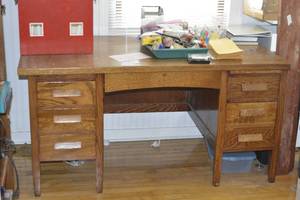 Wooden Desk with office supply contents