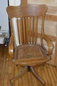 Antique Metal and wood swivel chair. Take a look at the hardware