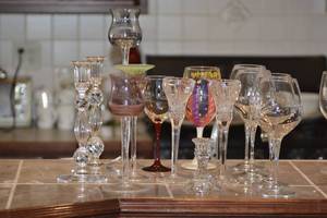 Various glassware including wine glasses and candle holders