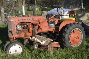 lot 28 image: Allis Chalmers Tractor with belly mower and rear wheel weights
