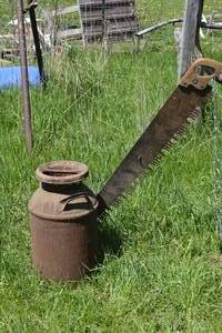 lot 41 image: Milk can with saw