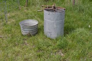 lot 43 image: little wonder honey extractor and metal pail