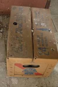 lot 49 image: cardboard Pabst Blue Ribbon carton with empty returnable bottles