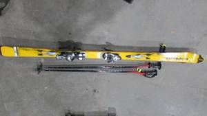 lot 65 image: Salomon Skis With Poles and Bag