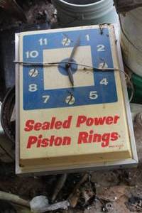 lot 546 image: Vintage Sealed Power Piston Rings Lighted Wall Clock