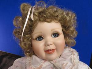 NUMBERED PORCELAIN DOLL