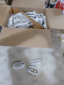 lot 90 image: Case of Peterson Manufacturing Clear Marker Lights