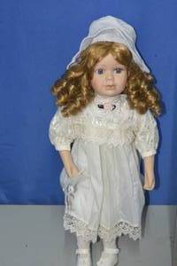 White dress Porcelain doll with pivoting head