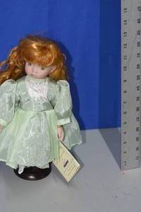 Doll in green by Seymour Mann