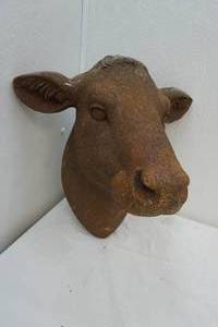 lot 32 image: cast stone-like cow head