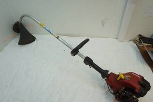 lot 213 image: Homelite gas powered weed whip