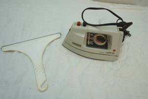 lot 288 image: Norelco clothing iron and shower squeegee