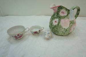 lot 289 image: floral ceramic water pitcher and piggy salt shaker