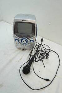 lot 128 image: Memorex CD Graphics Karaoke machine with microphone