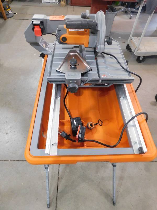 lot 82 image: RIDGID 9 Amp Corded 7 in. Wet Tile Saw with Stand