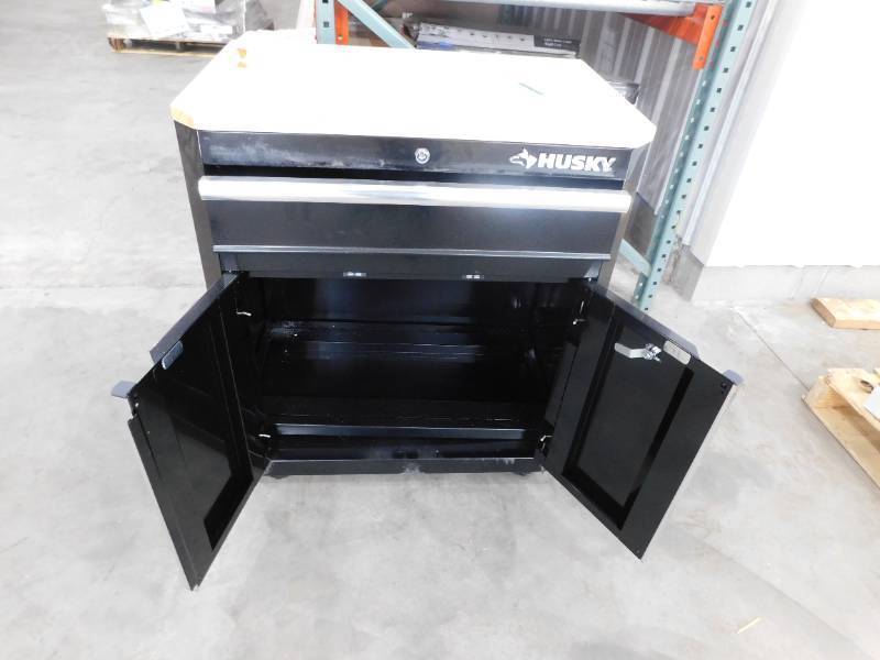 lot 97 image: Husky Ready-to-Assemble 24-Gauge Steel 1-Drawer 2-Door Garage Base Cabinet in Black (28 in. W x 33 in. H x 18 in. D)