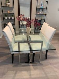 CB2 Chic Glass Dining Table with Black Metal Frame and 4 Upholstered Ivory Chairs