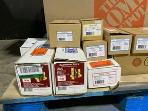 lot 110 image: Pallet with Assorted Brands of Door Knob Kits, Levers, HandleSets & More Various Conditions. See Pictures