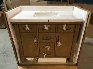 lot 28 image: Home Decorators Collection Bellington 42 in. W x 22 in. D Vanity in Almond Toffee with Cultured Marble Vanity Top in White with White Sink - Good Condition - Review all pictures
