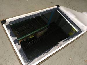 lot 39 image: Home Decorators Collection Sandon 46 in. W x 30 in. H Framed Rectangular Bathroom Vanity Mirror in Midnight Blue - In good condition - Review all pictures