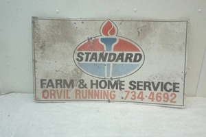 lot 111 image: Standard Farm and Home Service sign