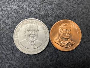 lot 97 image: John Wayne and Melvin Evans Tokens