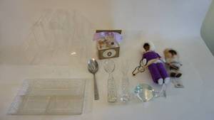 lot 73 image: Home decor lot includes crystal serving ware, table top plastic display, Eskimo dolls etc.