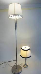 lot 114 image: Silver metal floor lamp 48 inches tall, silver metal table lamp 22 inches tall