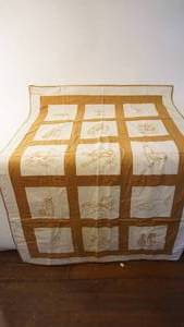lot 220 image: 38 x 60 embroidered crib quilt made in 1924