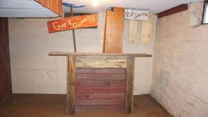 lot 312 image: Custom made bar Barnwood display stand, guy and galvanized sign