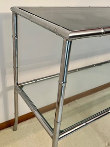 lot 18 image: Chrome Base Glass Top Two Tiered Console Table