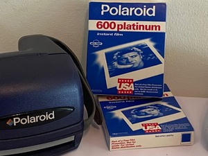 lot 242 image: Two Polaroid Cameras and Film