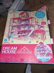 lot 117 image: 11 Room Dollhouse with Lights, Slide, Pets and Dolls