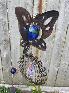 lot 176 image: Two Decorative Outdoor Hangers with Glass Gazing Balls