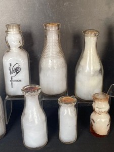lot 102 image: Variety of Vintage Milk Bottles