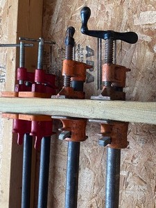 lot 53 image: Four Metal Pipe Clamps
