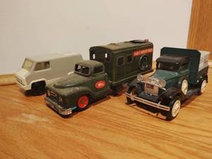 Three Old Bell System Toy Trucks