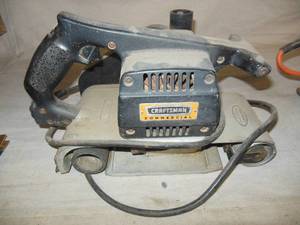lot 112 image: Craftsman Commercial 4 X 24 Belt Sander, Black and Decker Dual Action Pad Sander, Ram Sabre Saw