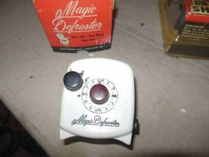 lot 120 image: Magic Defroster in Original Box Standard Plug, Freezer Plugs into it to Time Power OnOff, Plus HotCold Therapy Wrap