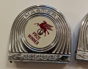 lot 59B image: Pair of Vintage Mobile Pegasus Measuring Tapes