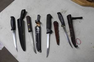 Lot of (4) Assorted Filet Knives with Leather Sheaths