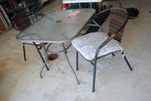 Glass top patio table with 2 padded...
